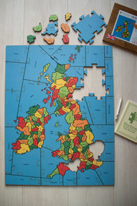 A puzzle of the British Isle counties that is partially made. every County is a separate piece.