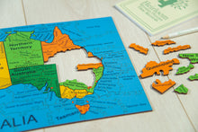 Load image into Gallery viewer, Map of Australia with colorful puzzle pieces on a wooden surface
